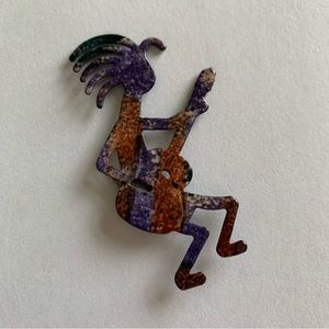 Kokopelli enameled magnet (could easily be converted to jewelry). Rust & purple